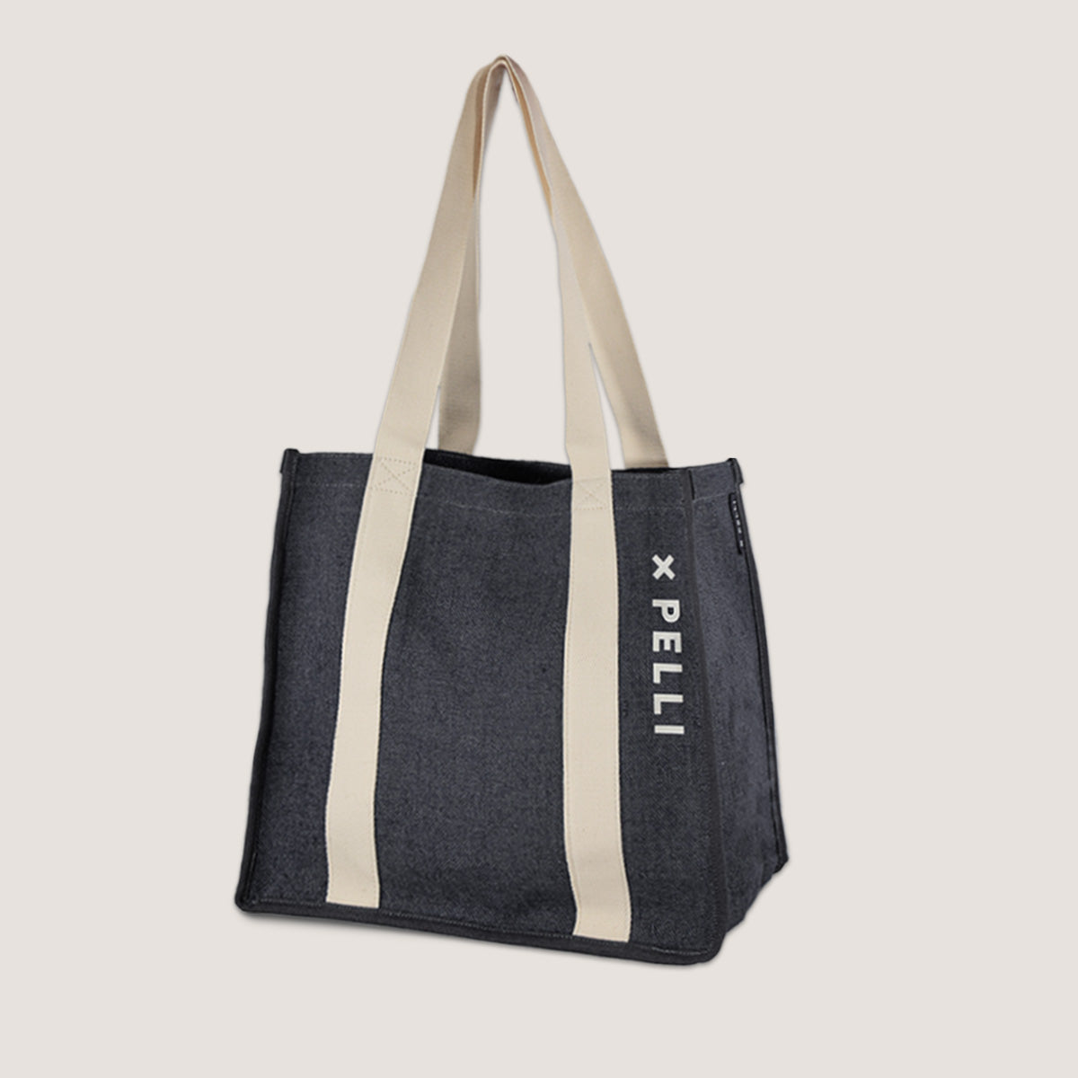 woven shopping bag in charcoal colour and cream straps